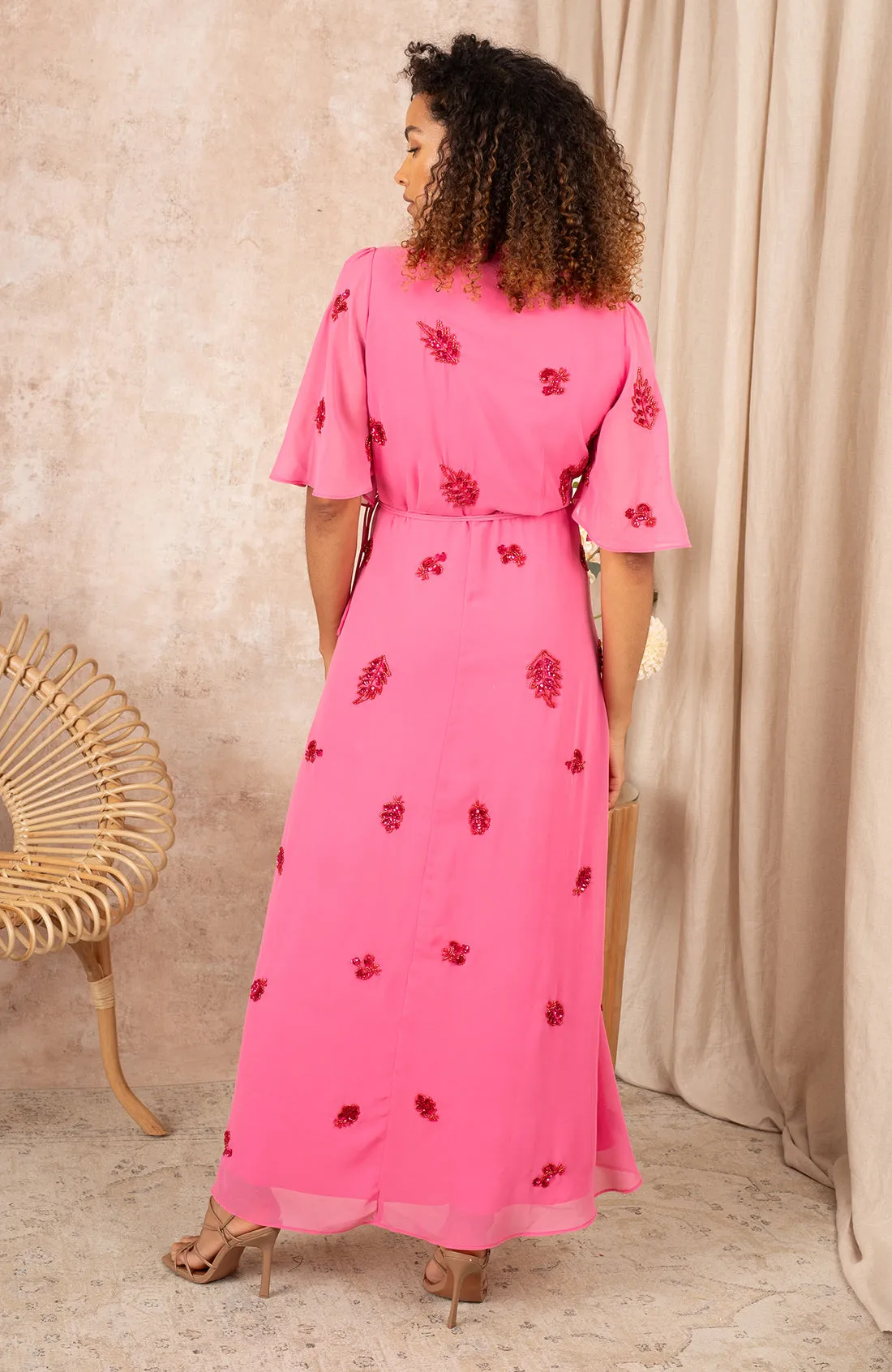 THE HEBE EMBELLISHED WRAP DRESS WITH TIE WAIST AND FLUTTER SLEEVE (PINK/RED) CURVE